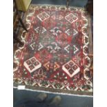 A hand-knotted Bakhtiari rug with geometric design