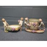 A pair of Amphora figural vases (2) Larger vase head has been off, the girls flowers with