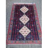 A Shiraz rug 202 x 125cm