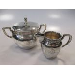 A Continental standard sugar bowl and cover and cream jug, both stamped '800' 10.8ozt gross (2)