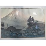 Two Japanese prints one of Mount Fuji, the other of the sea printed on fabric, both framed in hand
