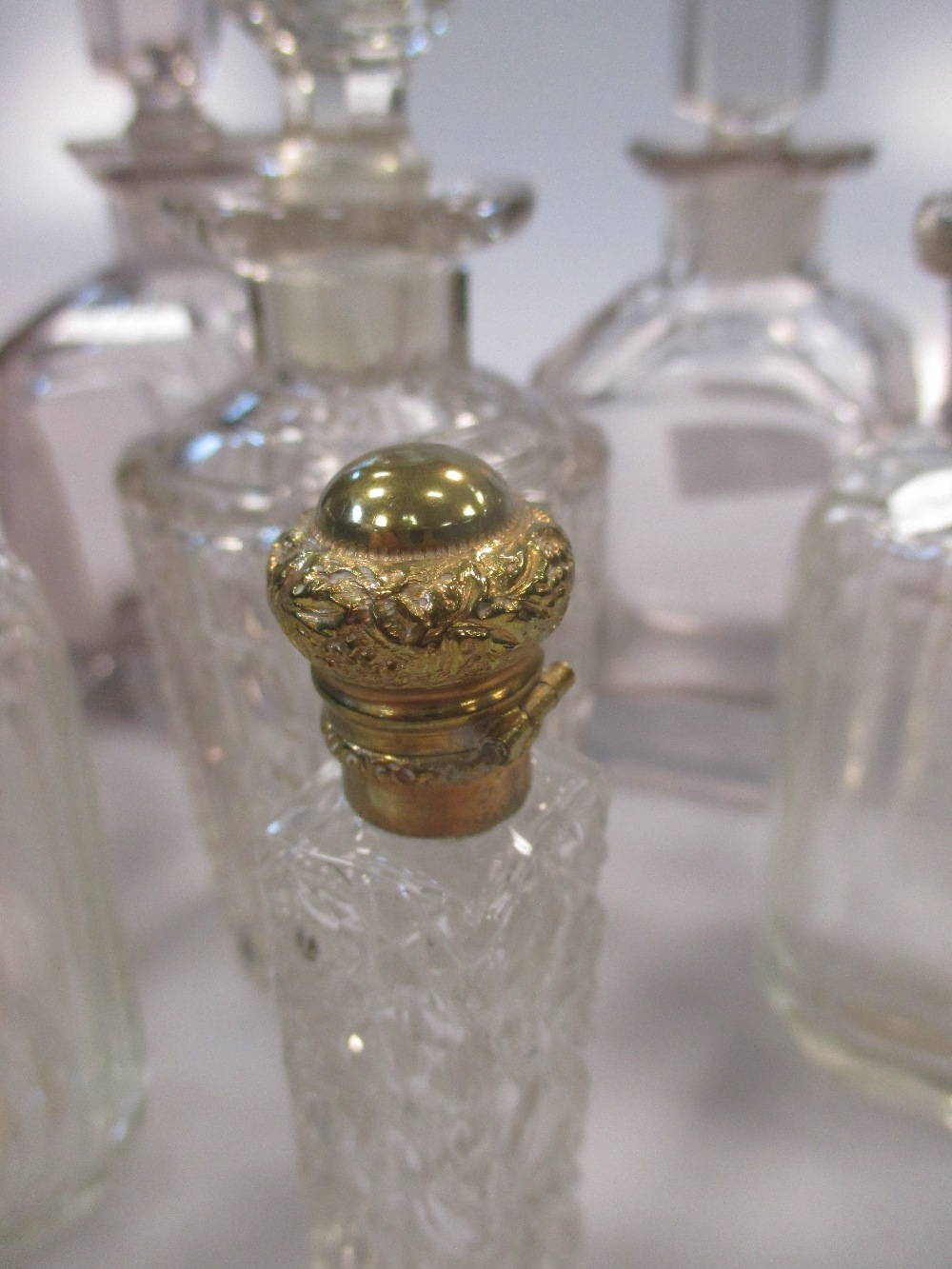 A collection of cut glass scent bottles, three with silver collars (13) - Image 2 of 3