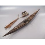 A Canadian Inuit style wood model of a rigged boat 53.5cm long