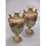 A large and impressive pair of Royal Worcester vases painted with spiders and brambles