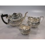 A silver three piece tea set with gadrooned border, 22oz (3)