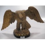 A Regency carved giltwood wall hanging eagle ornament (probably formerly a mirror cresting)