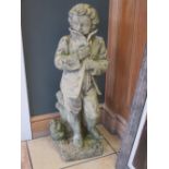 Two composition garden statues: boy 76cm high, figure on stand 128cm high