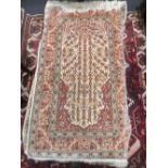 Two modern Persian silk miniature rugs or mats (2)