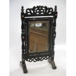 A Nineteenth Century Chinese hardwood mirror with mother of peral inlay