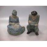 An pair of Irish porcelain figures of a seated old man and a young lady sewing, 20cm high