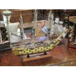 Four modern ship models to include Victory, Cuttysark etc and a pair of ship book ends