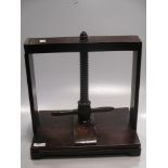 An early 19th century mahogany table top press with screw clamp