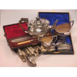 A quantity of silver handled table knives, a three piece silver plated tea set and other items of