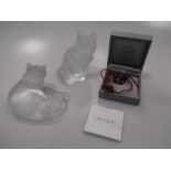 Three pieces of Lalique glassware - two cat ornaments and a butterfly pendant on a cord (3)