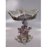 A pair of Sampson porcelain candleabra and a matching centre (3)