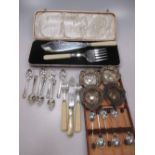 Seven silver teaspoons and four silver pin trays, 3.7ozt gross together with a cased set of silver