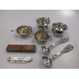 A pair of silver shell salts and spoons, a pair of cauldron salts and spoons, and two George III