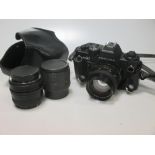 A Praktica BX20 SLR camera, with Carl Zeiss Jena DOR 50mm 1:1.4 lens, a 28mm lens, a Prakticar