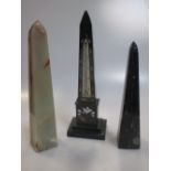 An Ashford marble obelisk set with a thermometer and two other stone obelisks