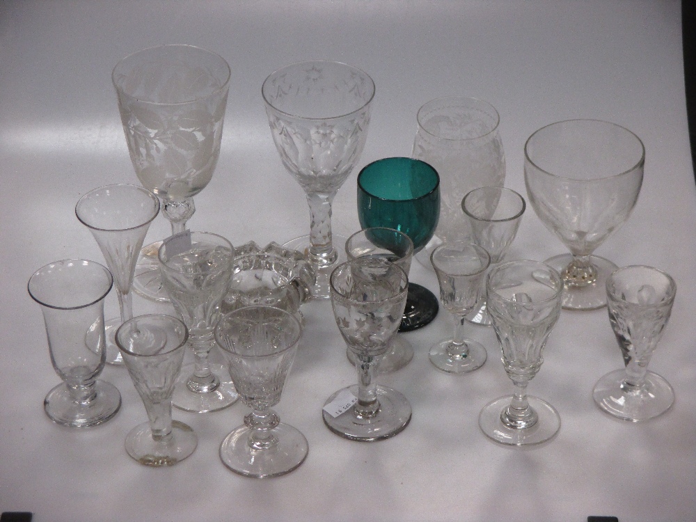 Various antique air-twist stem glasses, and a glass engraved with a giraffe and spiders web