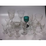 Various antique air-twist stem glasses, and a glass engraved with a giraffe and spiders web