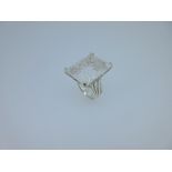 A modern rock crystal statement ring, the large fantasy cut rectangular rock crystal 2½ cm x 2cm