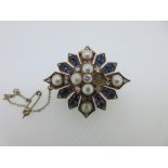 A Victorian diamond, sapphire and half pearl brooch, designed as a quatrefoil of half pearls (not