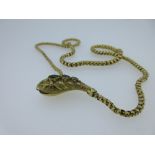 A Victorian snake necklace set with emeralds, the cast and textured head with polished leaf and