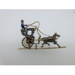 A novelty diamond and enamel Hansom cab brooch, the horse-drawn cab with freely turning wheel