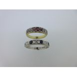 A nine stone ruby and diamond ring and a seven stone sapphire and diamond ring, the first designed