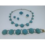 A Victorian matched parure of turquoise jewellery, comprising a bracelet, necklace, earclips, brooch