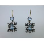 A pair of blue topaz, seed pearl and diamond earpendants, each hook fronted by a round cut blue