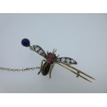 A Victorian diamond and gem set insect brooch, the spread wings set with graduated old cut diamonds,