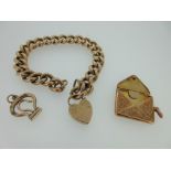 A 9ct gold bracelet with heart locket, hallmarked stamp case and button hook pendants, the chunky