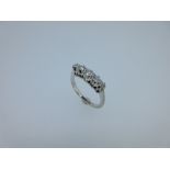 An Edwardian style five stone diamond ring, the graduating round old brilliant cut diamonds claw set