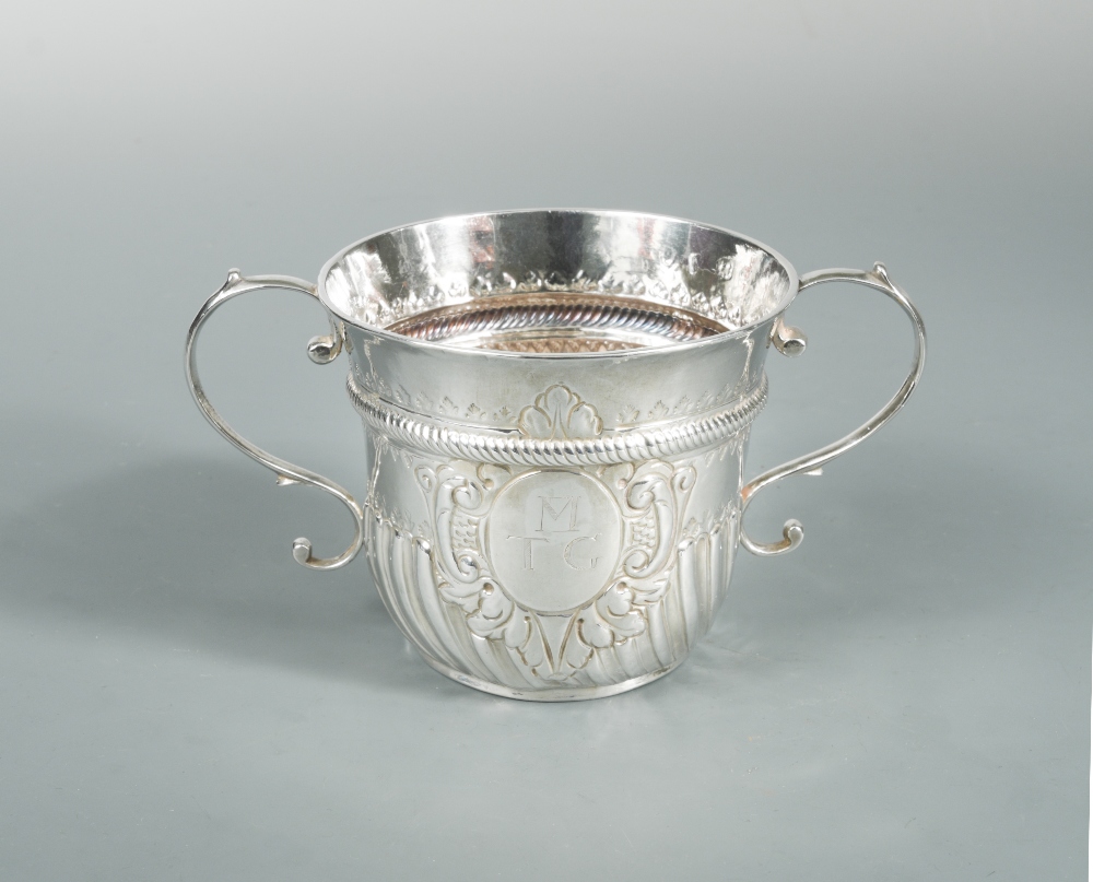 A George II silver two handled porringer, possibly by Peter Simon, London 1726, of traditional