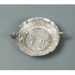 A Victorian silver two handled tastevin, sponsor mark unidentified, London import marks, 1890, in