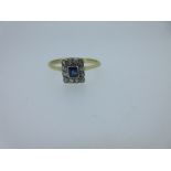 An early 20th century sapphire and diamond cluster ring, the central rectangular facetted sapphire