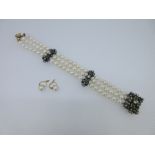 A diamond, emerald and cultured pearl bracelet together with a pair of Continental pearl earstuds,