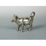 A German naturalistic cow creamer, marked with the Reichsmark and '925', the detailed cast body with