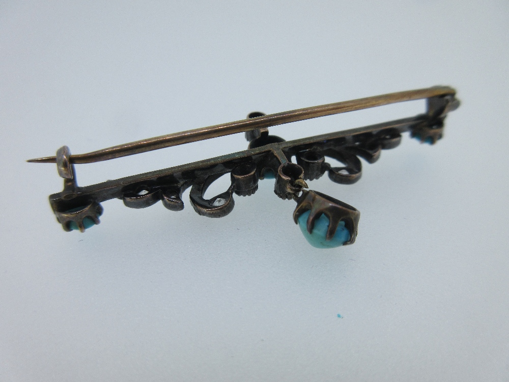 A turquoise and diamond bar brooch, the claw set oval cabochon turquoise with a crimp collet set old - Image 5 of 5