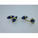 A pair of double ended lapis lazuli and pearl cufflinks, each end a reeded torpedo of lapis lazuli