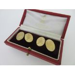 A pair of 9ct gold double-ended cufflinks cased by Asprey, each with plain oval flat plaques and