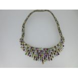 A "tutti frutti" gem set bib style fringe necklace, the front section a fringe graduating from 2cm