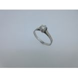 A single stone diamond ring, the round brilliant cut diamond, estimated weight 0.40cts, six claw set