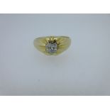A single stone old cut diamond ring, the plain shank swelling at the front and cast into a