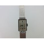 Movado - A lady's diamond set cocktail watch, circa 1960, the signed rectangular matte finished dial