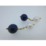 A pair of lapis lazuli and cultured pearl cufflinks, each with one end designed as a fully drilled