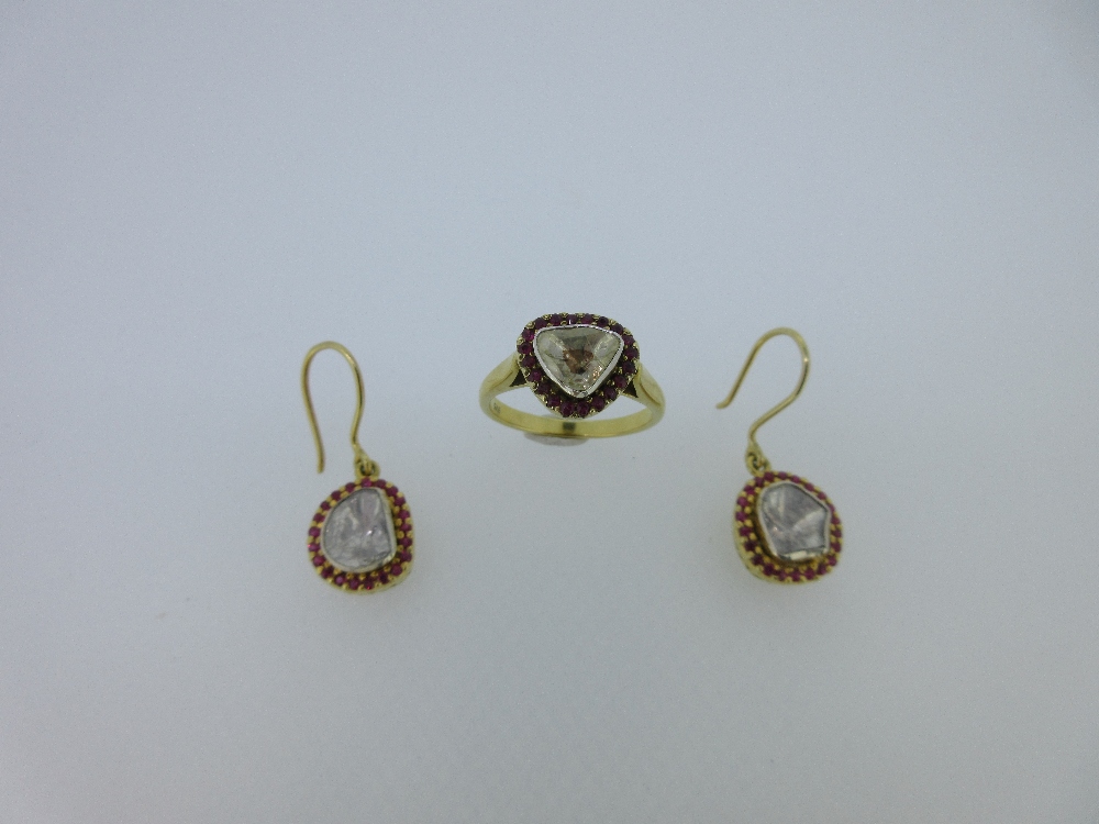 A silver gilt ruby and diamond cluster ring and earpendant suite, the ring rub over set with a