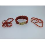 A vintage Dutch red coral bracelet and two coral bead necklaces, the bracelet designed as a broad